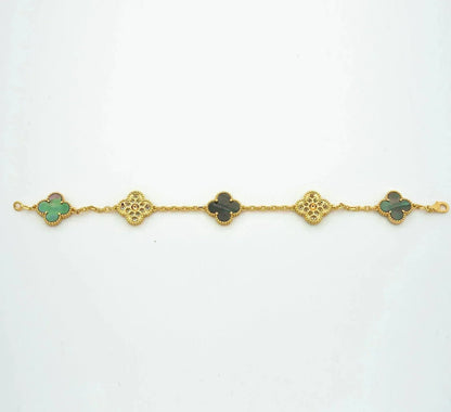 {
  "Bling Jewelrys": "Bling Jewelry",
  "CLOVER 5 MOTIF GRAY MOP BRACELET COLLECTION": "KLEEBLATT 5-MOTIV GRAU PERLMUTT ARMBAND KOLLEKTION"
}