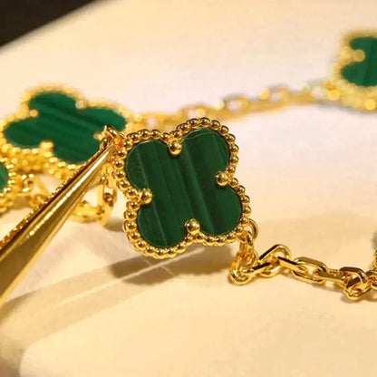 {
  "Bling Jewelrys ": "Bling Jewelrys ",
  "CLOVER  5 MOTIF MALACHITE BRACELET COLLECTION": "KLEEBLATT 5-MOTIV MALACHIT-ARMBAND KOLLEKTION"
}