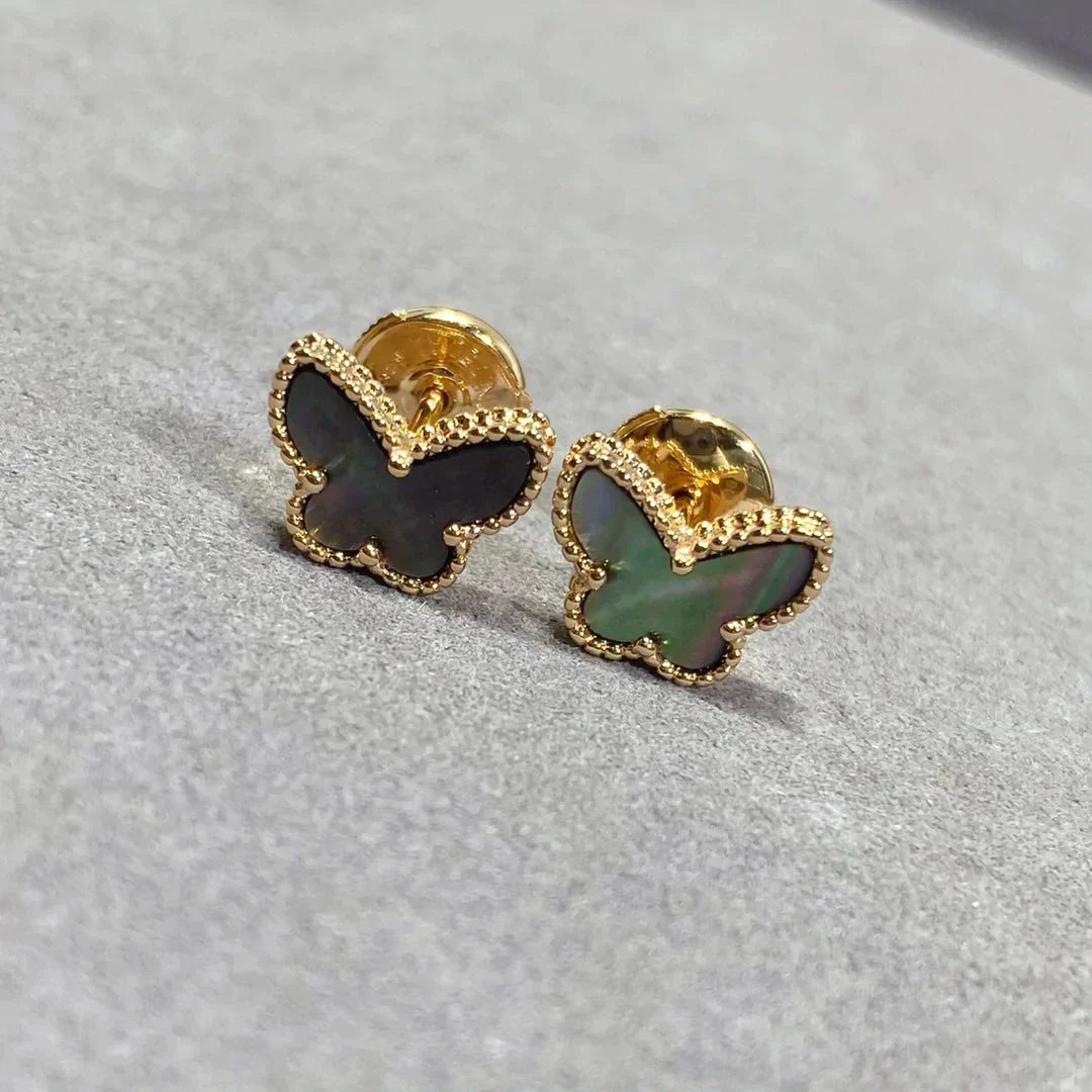 {
  "Bling Jewelrys": "Bling Jewelry",
  "BUTTERFLY DARK MOP  EARRINGS": "SCHMETTERLINGS-OHRRINGE AUS DUNKLEM PERLMUTT"
}