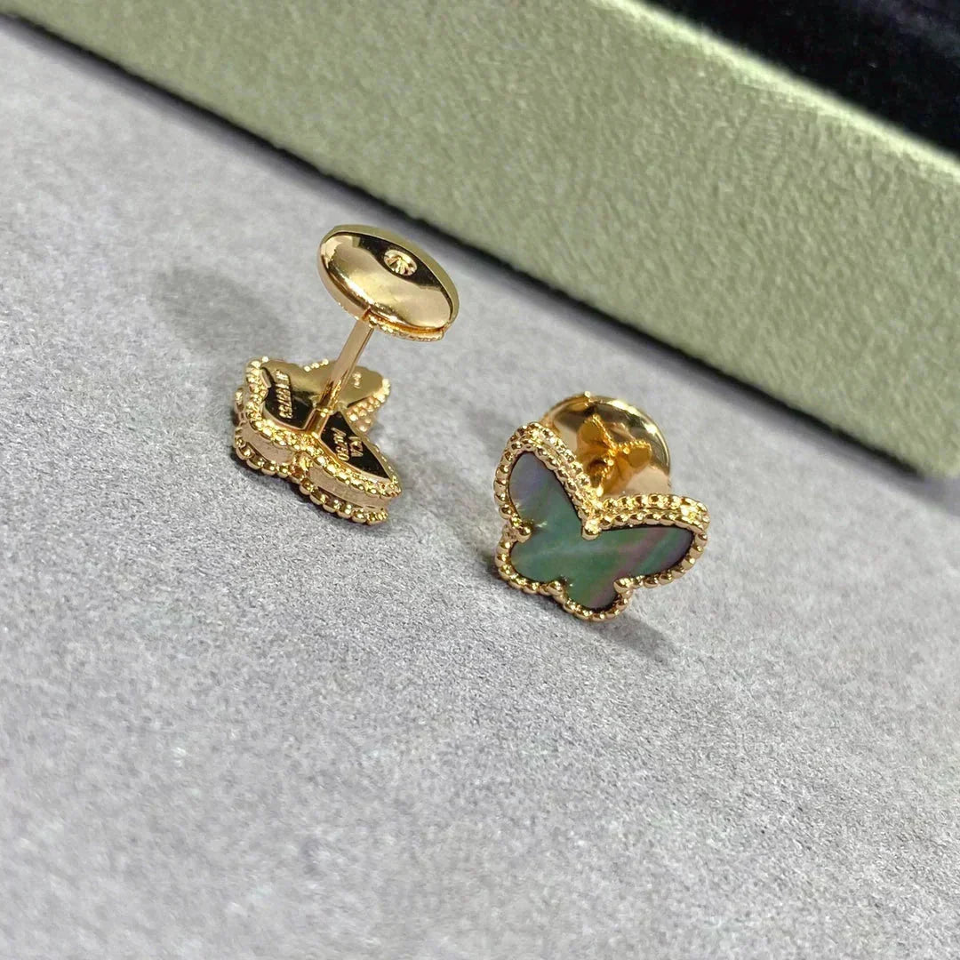 {
  "Bling Jewelrys": "Bling Jewelry",
  "BUTTERFLY DARK MOP  EARRINGS": "SCHMETTERLINGS-OHRRINGE AUS DUNKLEM PERLMUTT"
}