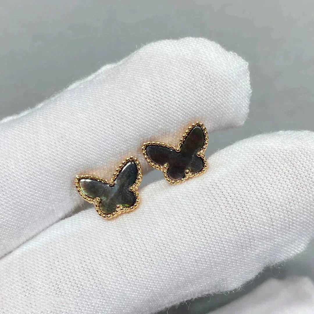 {
  "Bling Jewelrys": "Bling Jewelry",
  "BUTTERFLY DARK MOP  EARRINGS": "SCHMETTERLINGS-OHRRINGE AUS DUNKLEM PERLMUTT"
}