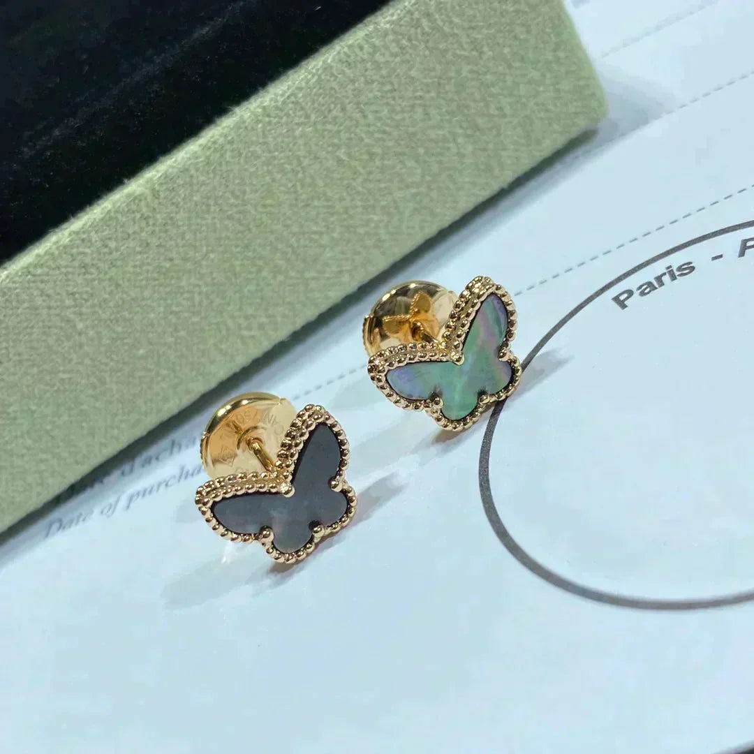 {
  "Bling Jewelrys": "Bling Jewelry",
  "BUTTERFLY DARK MOP  EARRINGS": "SCHMETTERLINGS-OHRRINGE AUS DUNKLEM PERLMUTT"
}