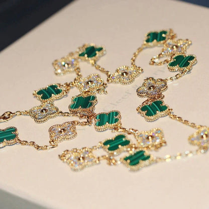 {
  "Bling Jewelrys": "Bling Jewelrys",
  "CLOVER 20 MOTIFS MALACHITE DIAMOND NECKLACE": "KLEEBLATT-HALSKETTE MIT 20 MOTIVEN AUS MALACHIT UND DIAMANTEN"
}