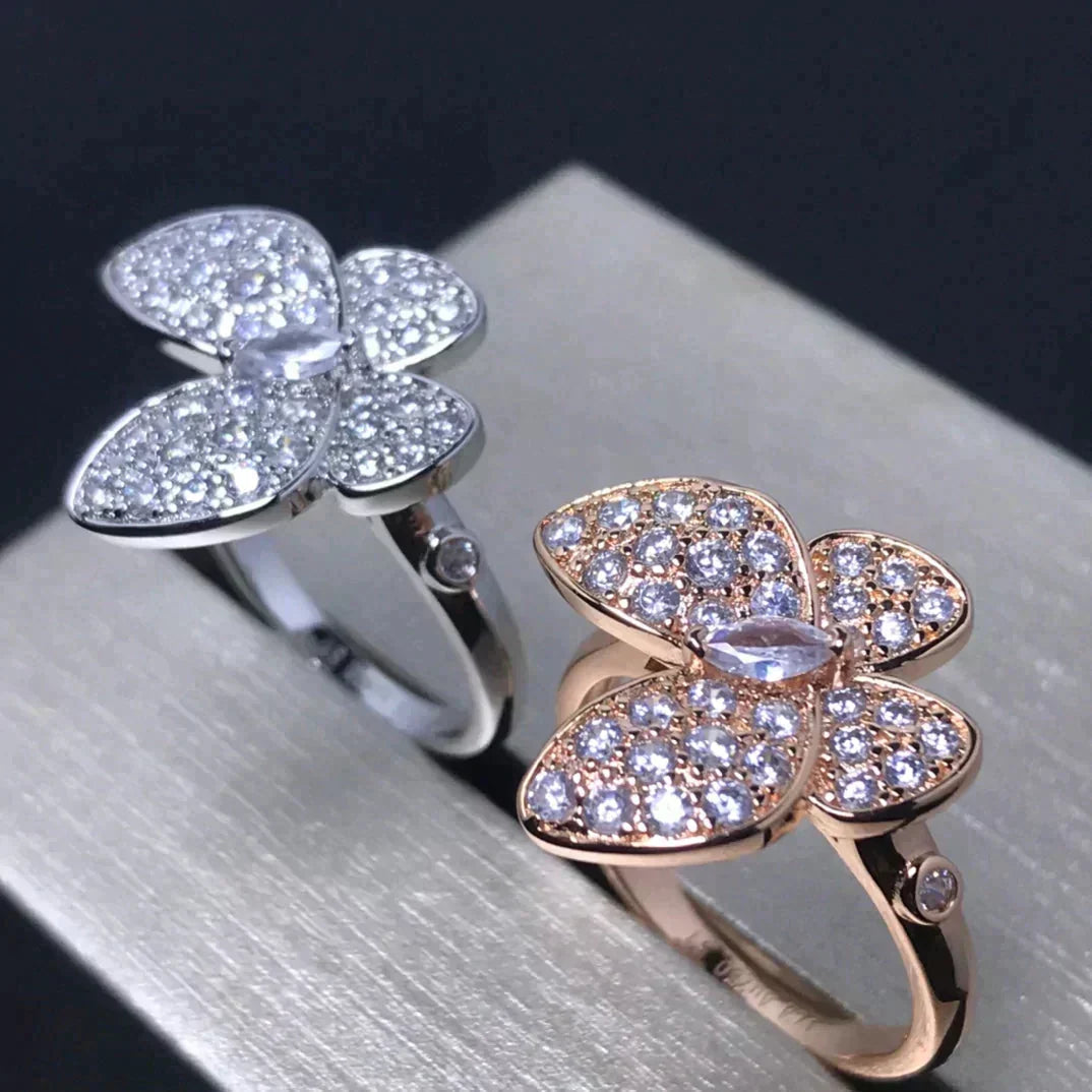 {
  "Bling Jewelrys": "Bling Jewelry",
  "BUTTERFLY PINK GOLD DIAMOND RING": "SCHMETTERLINGS-RING AUS ROSÉGOLD MIT DIAMANTEN"
}