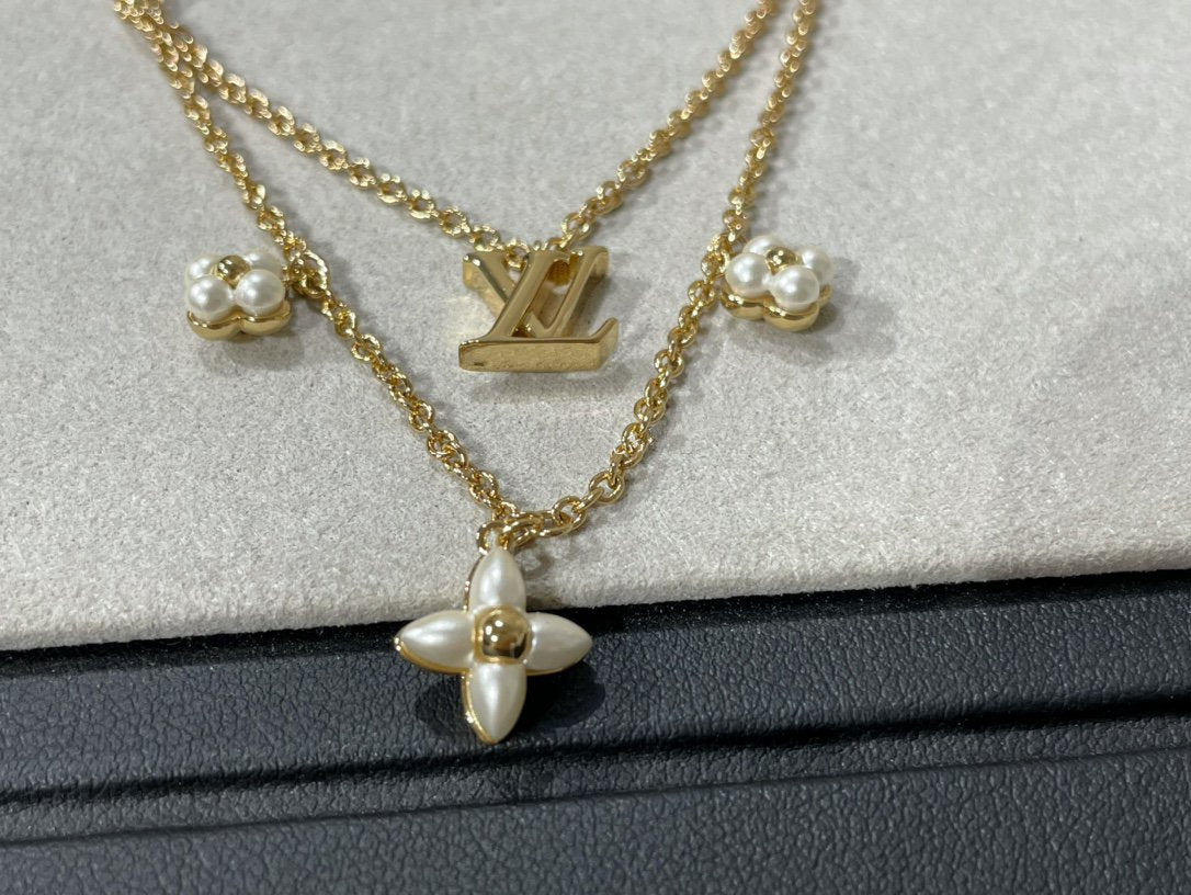 {
  "Bling Jewelrys ": "ブリングジュエリー",
  "FLOWERGRAM GOLD MOP DOUBLE ROW NECKLACE": "フラワーグラム ゴールド マザーオブパール 2連ネックレス"
}