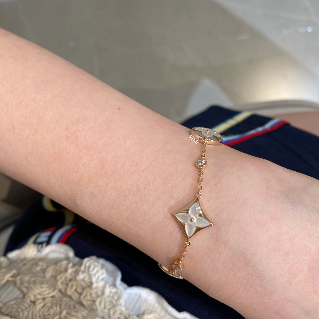 [Bling Jewelrys ]STAR AND SUN 4 MOTIF WHITE MOP PINK GOLD BRACELET