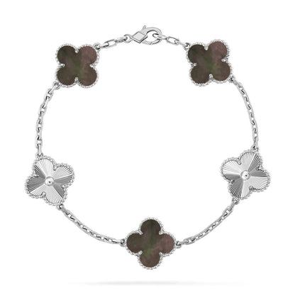 {
  "Bling Jewelrys": "Bling Jewelry",
  "CLOVER 5 MOTIF GRAY MOP BRACELET COLLECTION": "KLEEBLATT 5-MOTIV GRAU PERLMUTT ARMBAND KOLLEKTION"
}