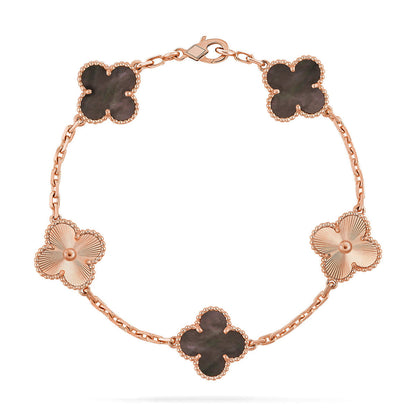 {
  "Bling Jewelrys": "Bling Jewelry",
  "CLOVER 5 MOTIF GRAY MOP BRACELET COLLECTION": "KLEEBLATT 5-MOTIV GRAU PERLMUTT ARMBAND KOLLEKTION"
}