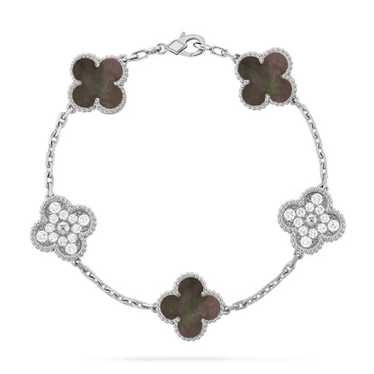 {
  "Bling Jewelrys": "Bling Jewelry",
  "CLOVER 5 MOTIF GRAY MOP BRACELET COLLECTION": "KLEEBLATT 5-MOTIV GRAU PERLMUTT ARMBAND KOLLEKTION"
}