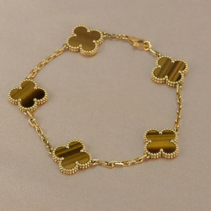 {
  "Bling Jewelrys": "ブリングジュエリー",
  "CLOVER 5 MOTIFS TIGER EYE BRACELET COLLECTION": "クローバー 5モチーフ タイガーアイ ブレスレット コレクション"
}