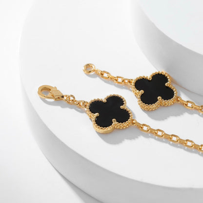 {
"Bling Jewelrys ": "Bling Jewelrys ",
"CLOVER 10 MOTIFS ONYX NECKLACE": "KLEEBLATT 10 MOTIVE ONYX HALSKETTE"
}