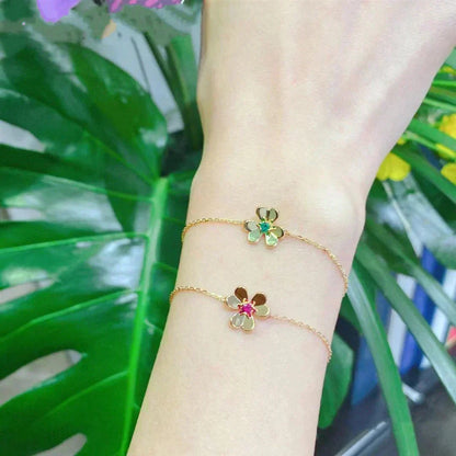 {
  "Bling Jewelrys ": "FRIVOLE GOLD BLUMEN-ARMBAND MIT ROSA MALACHIT"
}